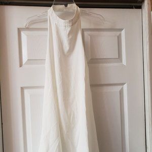 White dress with pearl detail on the neck